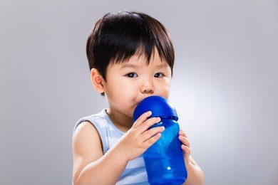 asian baby drinking water