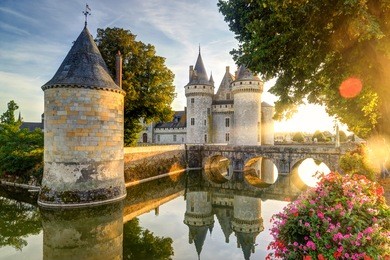 the chateau of sully-sur-loire in the sunlight with lens flare, france. this castle is located in the loire valley, dates from the 14th century and is a prime example of medieval fortress.