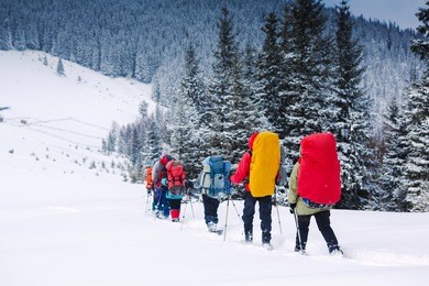 young people snowshoeing