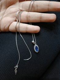 broken silver necklace pendant blue