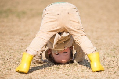 cute girl playing on the lawn