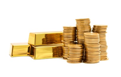 gold bars and coins isolated on white