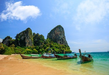 traditional longtail boat at railay beach, ao nang, thailand