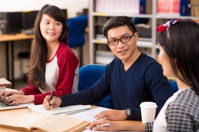 asian students studying in a university library