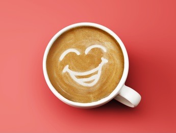 face laughing coffee cup concept isolated on red background