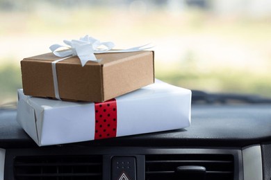 white and brown gift box placed on the car dashboard, valentine's day, women's day and mother's day concept