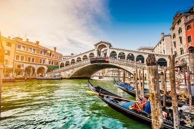 panoramic view of famous canal grande with famous rialto bridge at sunset in venice, italy with retro vintage instagram style filter effect