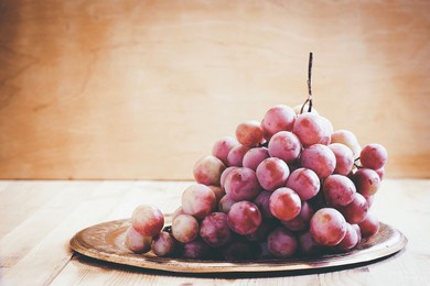 pink grapes on a metal tray