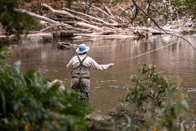 fly fishing in a river in australia