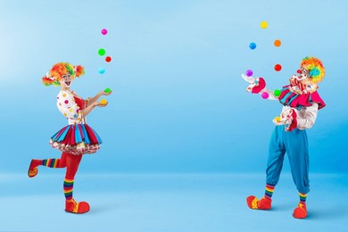funny jugglers clowns juggling balls in the circus, entertainers as joker in a suit and wig, with clown whiteface makeup. trickster, jester, pantomime, mime, and a professional actors at events