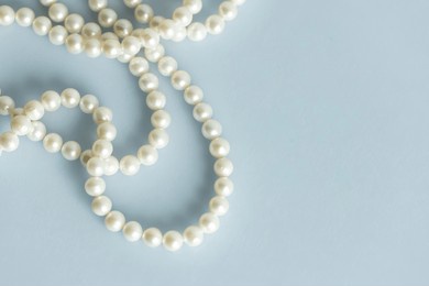 pearl beads, freshwater pearl necklace with timeless stylish chique white luxurious pearls on a string showing elegance of the gift from nature, romantic chic appearance, natural materials