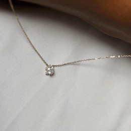 elegant, contemporary, handmade women's necklace with a modern shape and colorful sparkling stones