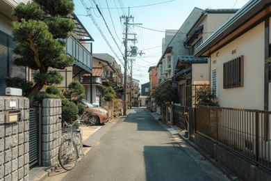 quiet and cozy alley residential in japanese neighborhood with traditional houses, bicycle, car in suburban of japan