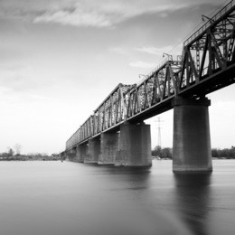 bridge in kiev, ukraine. daytime long exposure photo taken in black and white.