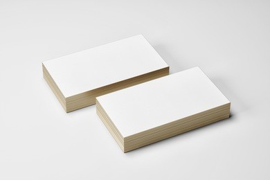 white bussiness card mockup isolated whith gold side