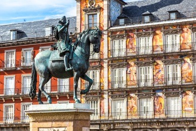 statue of philip iii at mayor plaza in madrid in a beautiful summer day, spain