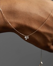 unrecognizable young woman with a stylish, trendy, handmade necklace with an innovative, modern shape _ jewelry model 