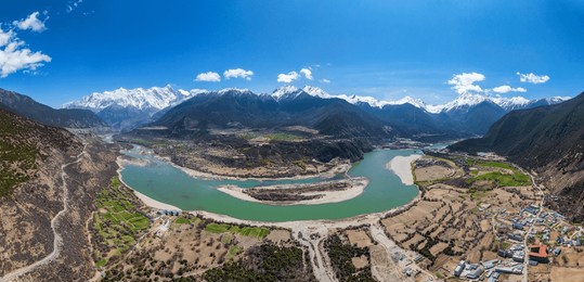nyingchi, tibet, china - 7th april 2025 - beautiful full view of snow mountains and yarlung zangbo river
