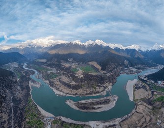 nyingchi, tibet, china - 7th april 2025 - beautiful full view of snow mountains and yarlung zangbo river before night