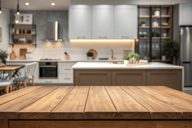 wood table top on blurred kitchen background. can be used mock up for montage products display or design layout	