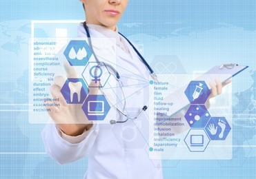 young female doctor touching icon of media screen