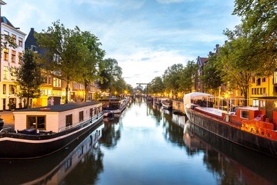 canals of amsterdam at night. amsterdam is the capital and most populous city of the netherlands