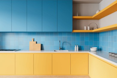 bright kitchen interior featuring modern blue upper and yellow lower cabinets, blue tiled backsplash, and white countertop. 3d rendering