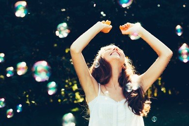 girl having fun with bubbles