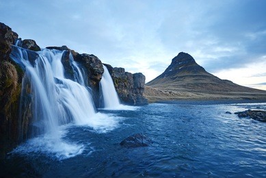 kirkjufell mountain with waterfall cascades in iceland