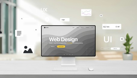 computer display on office desk surrounded by floating ui elements like menu icons, share buttons, image boxes, and text alignment blocks
