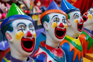 colourful carnival game clowns at the greek glenti festival in darwin.
