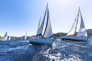 sailing in the wind through the waves at the aegean sea in greece. sailing regatta. luxury yachts. 