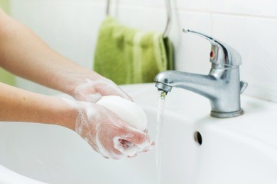 washing hands with soap in bathroom. hygiene 