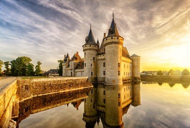 the chateau of sully-sur-loire at sunset,  the loire valley, france. beautiful view of the medieval castle in sunlight. loire valley is unesco world heritage site.