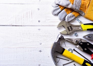 set of tools over a wood background