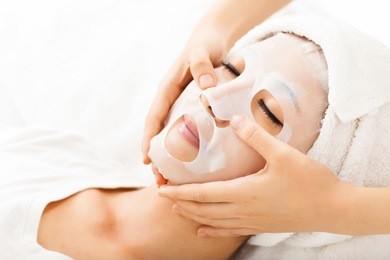  young lady with facial mask at spa