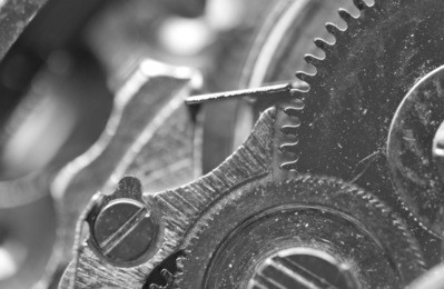 black white background with metal cogwheels a clockwork. macro. conceptual photo for your successful business design or technological process