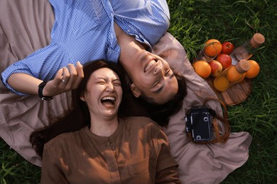 happy young asian couple enjoying together on sunny day.