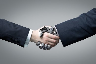 businessman and robot's handshake. artificial intelligence technology