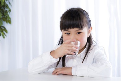 little girl have a drink of water