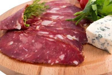 sliced sausage and cheese breakfast isolated on a white background.