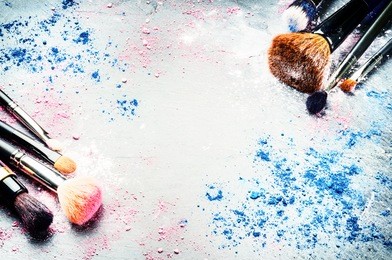 makeup brushes and crushed eyeshadow