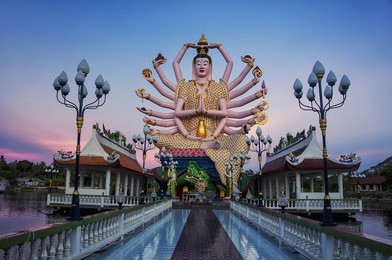 buddhist pagoda at sunset. temple complex wat plai laem on samui island. thailand, koh samui