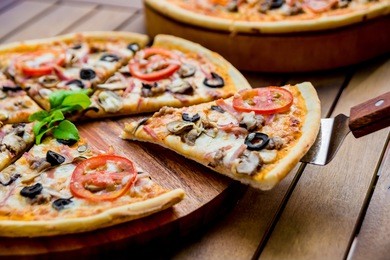 large pizza on a wooden table. restaurant