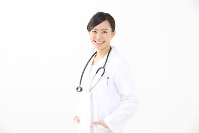 female doctor smiling - isolated over a white background