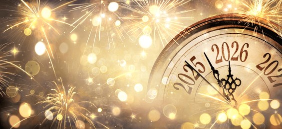 2026 new year - clock and golden fireworks - countdown to midnight - abstract defocused background