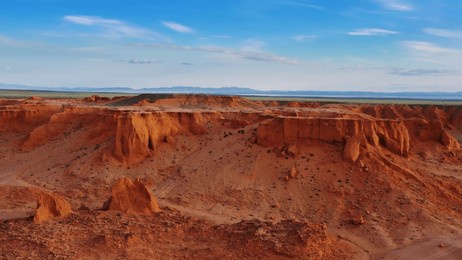 aerial view of the bayanzag flaming cliffs at sunset in mongolia, found in the gobi desert