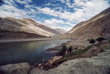 tibetian landscape with clouds and river brahmaputra.