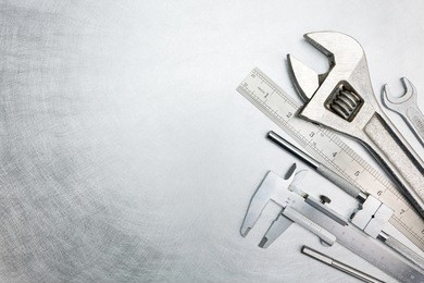 set of  metal working tools on scratched metal surface