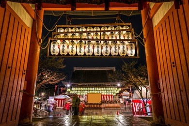 lanterns hanging at yasaka shrine in kyoto wish visitors a happy new year. 